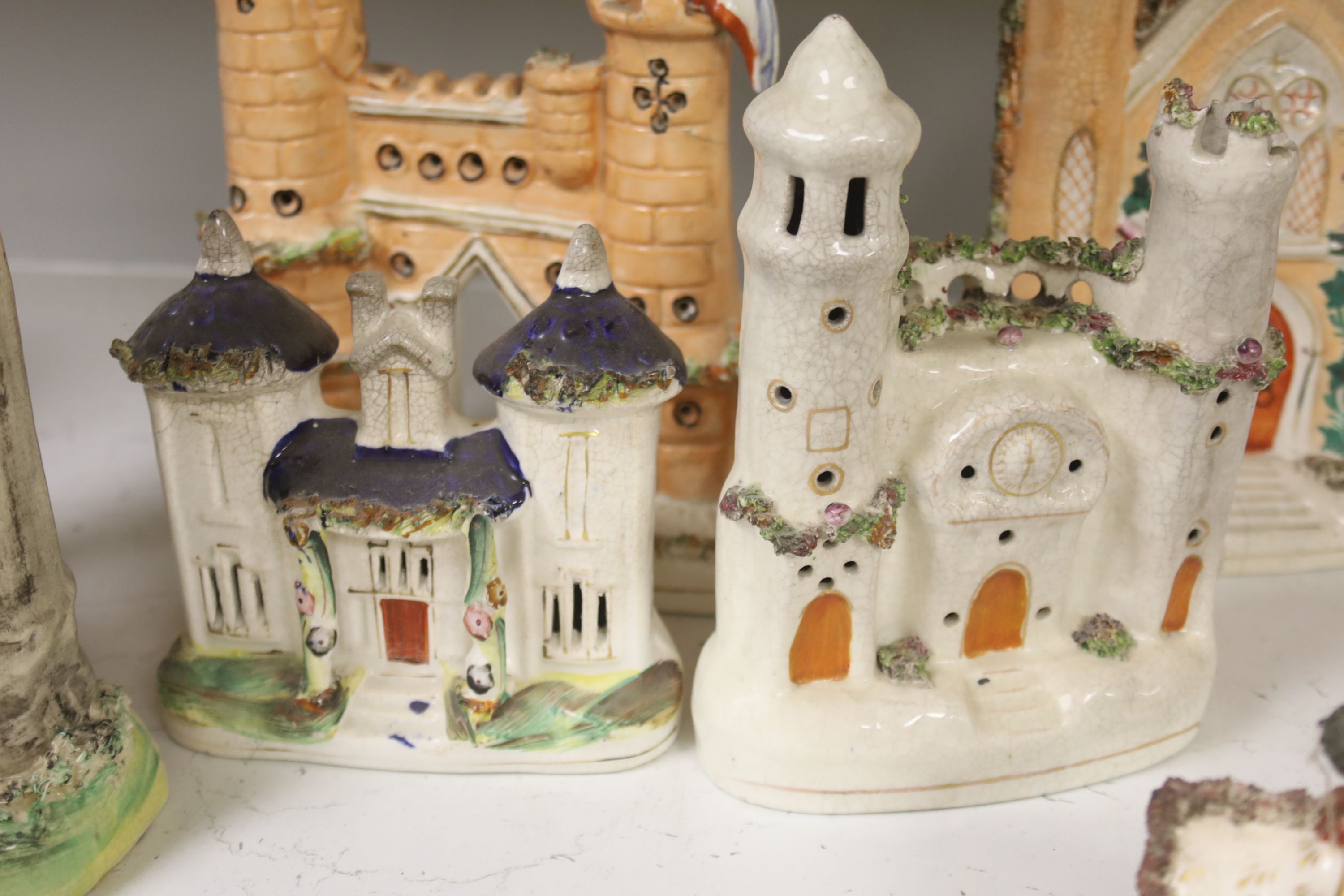 A collection of architectural Staffordshire pottery groups, tallest 22cm